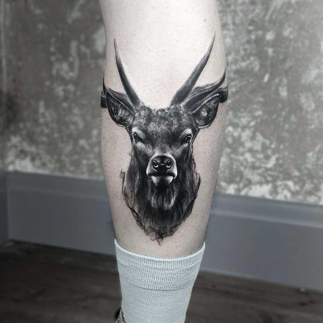 Deer skull tattoo located on the forearm,